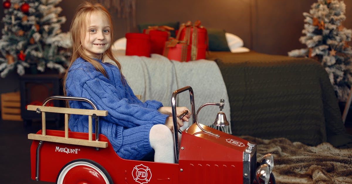 Car on ferry between Gozo and Malta during the Christmas period - Portrait of Smiling Girl in Retro Car