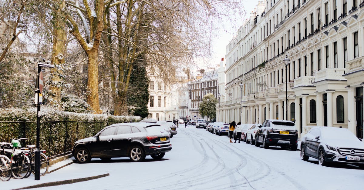 Car rental at 20 years old in UK - London streets covered with snow on sunny day