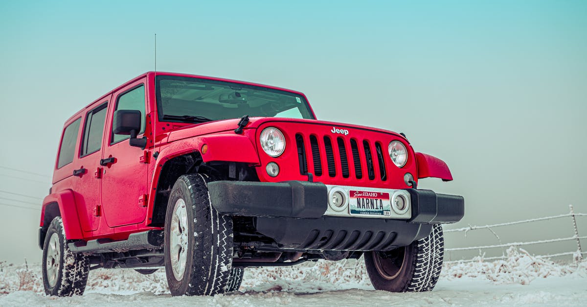 Car rental cancellation because of lack of winter tires - Red Suv on Snow Covered Ground