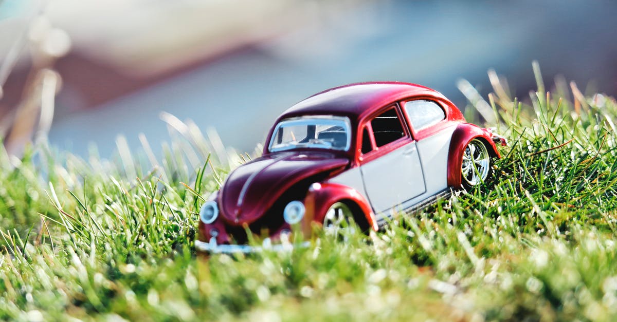 Car rental deposit €730 for 24h in a small car? - Red and White Beetle Car Toy on Grass Field in Bokeh Photography