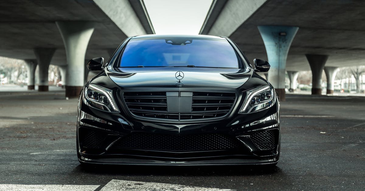 Car rental insurance in US with Canadian hired car - Photo Of Mercedes Benz On Road During Daytime