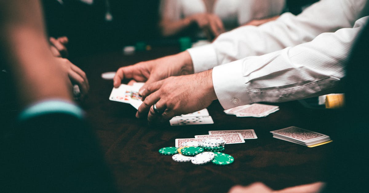 Cards, dices, poker chips, board games, etc. in Thailand - People Playing Poker