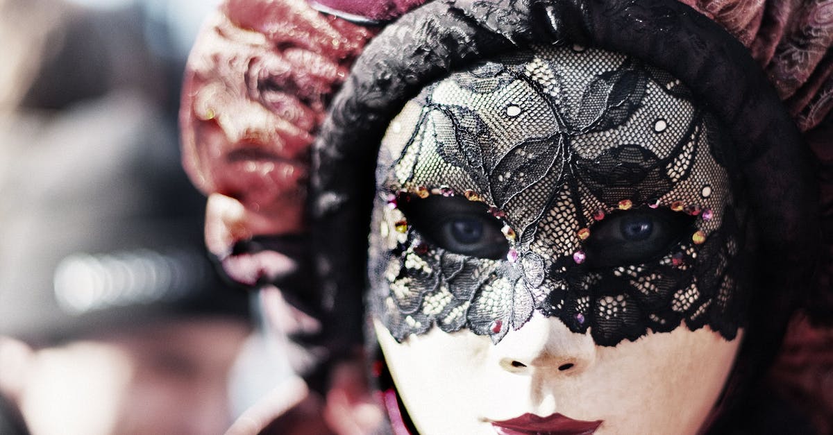 Carnival in Venice - what to expect - White, Black, and Maroon Floral Masquerade Mask