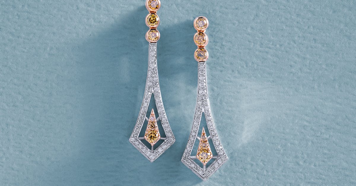 Carry Diamond earrings from India to US [duplicate] - Earrings with Diamonds on Blue Surface