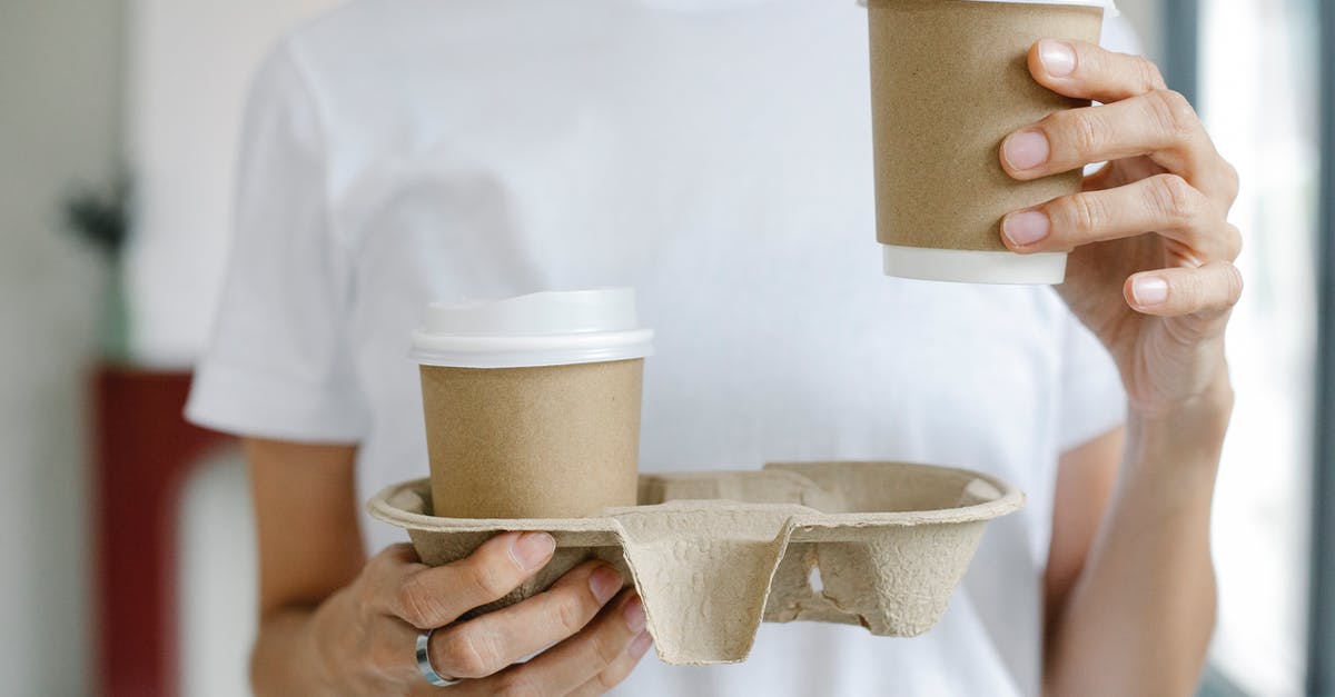 Carry domestic currency while going abroad [duplicate] - Crop female enjoying takeaway coffee