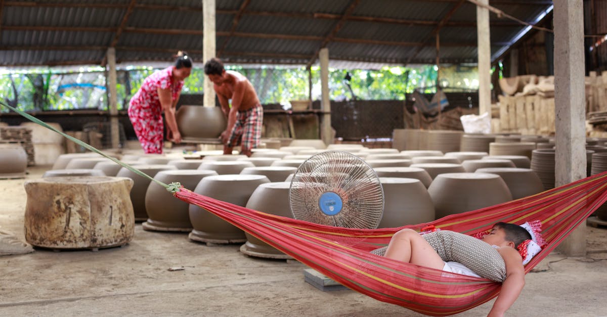 Carry on crafting projects - Man Sleeping on Red Hammock Near Clay Pots