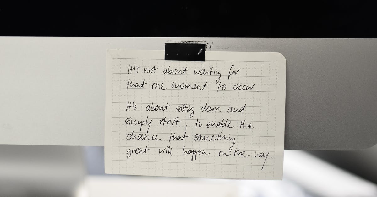 Carry on Luggage size in United air line - Written text with black words on rectangular shaped paper sheet with square ornament in daylight