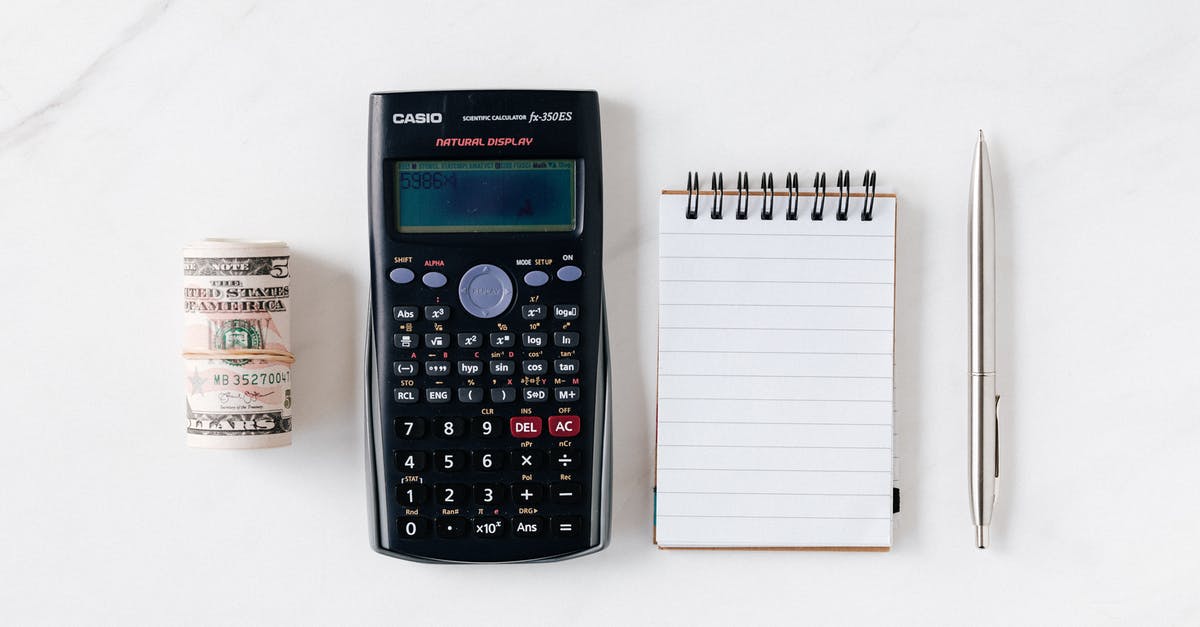 Carrying electronics from USA to Canada - Composition of calculator with paper money and notebook with pen