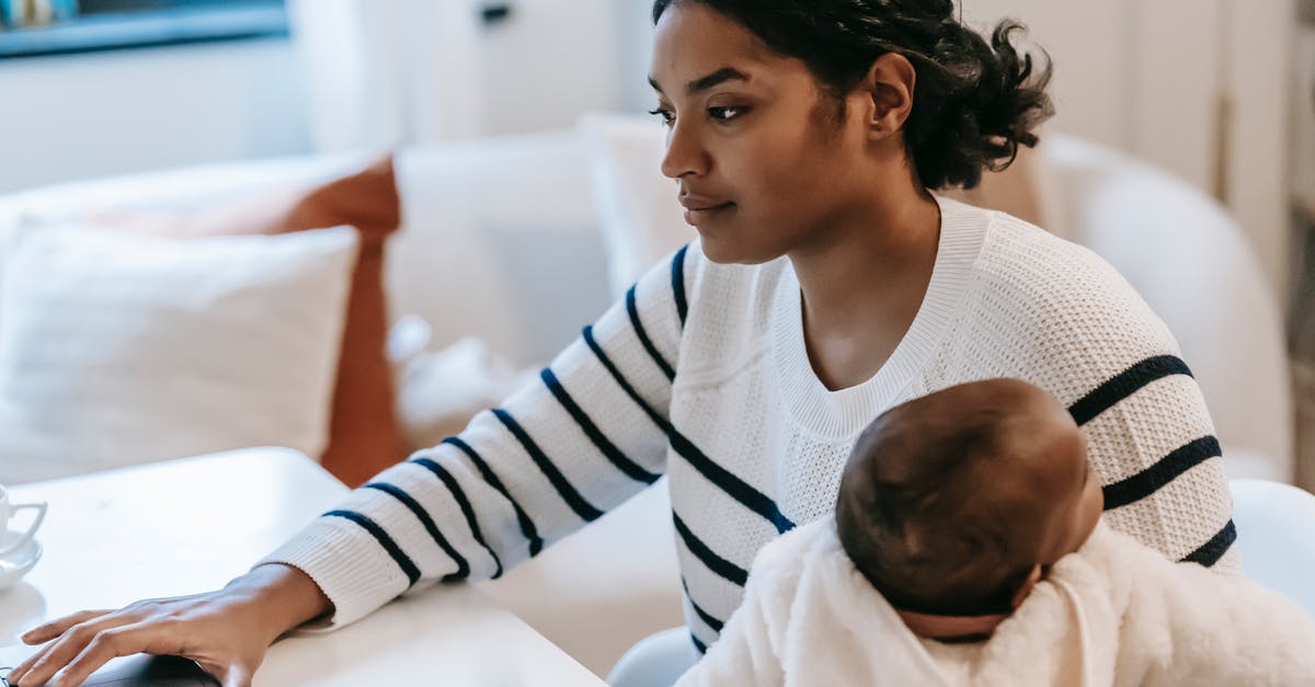 Carrying my laptop to abroad from India - Mother Carrying Her Baby while Working From Home