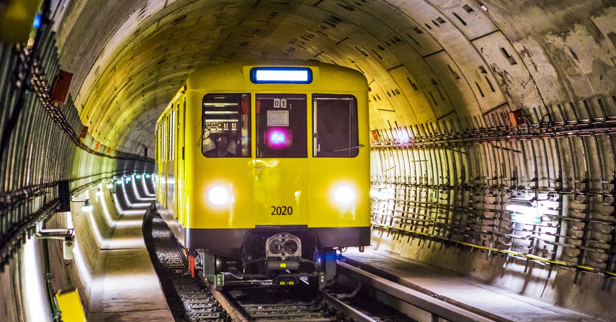 Carrying poster tube on Amtrak trains - Yellow and Black Train Under Tunnel