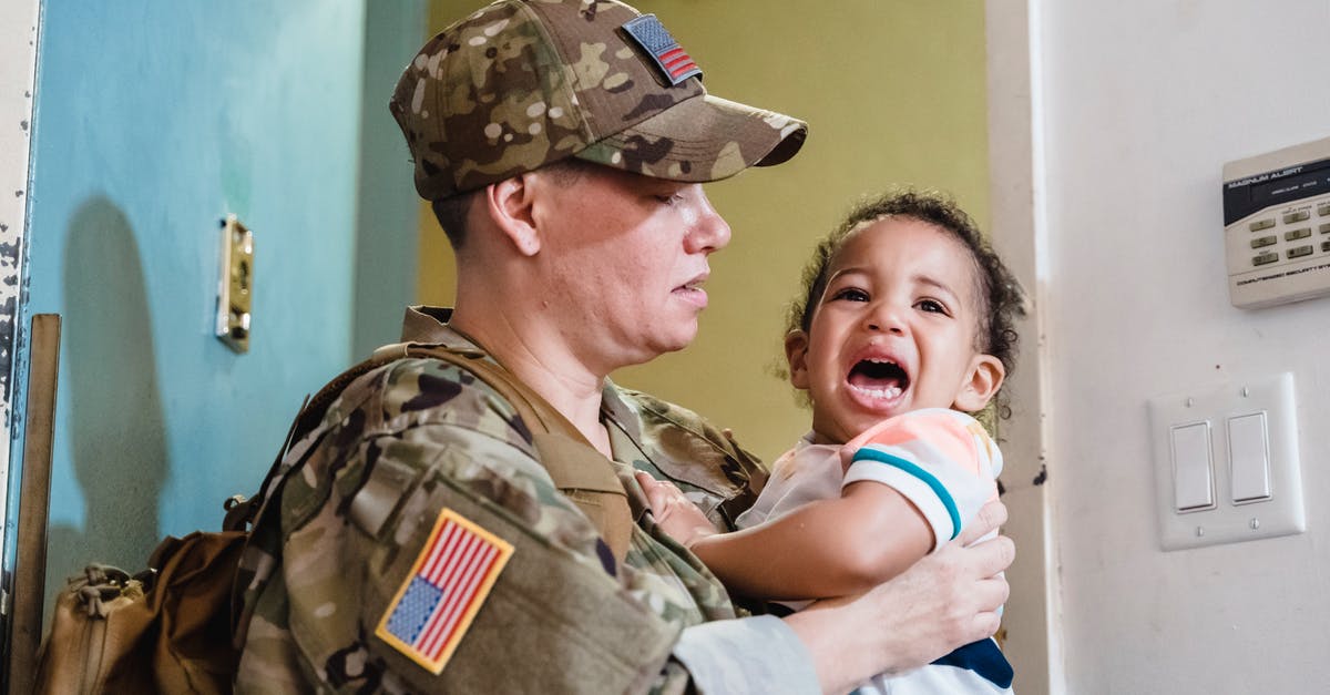 Carrying US Kevlar ACH out of the US - Person Carrying a Crying Little Boy