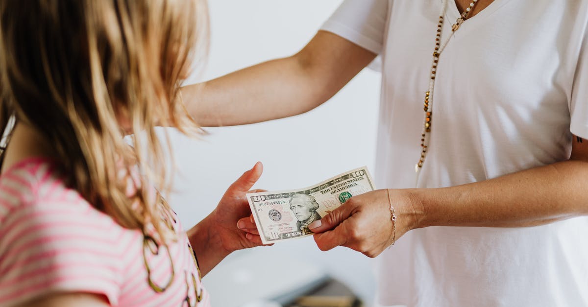 Cash allowance while transiting through Zurich - Woman Giving 10 Dollars to a Girl