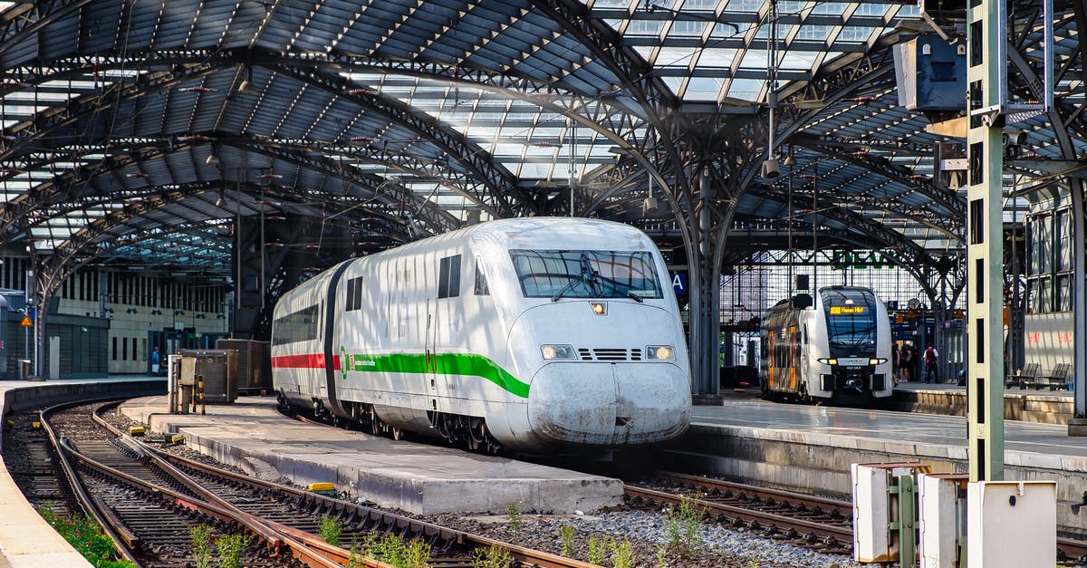 CDG to Bordeaux train options - White and Green Train on Rail Tracks