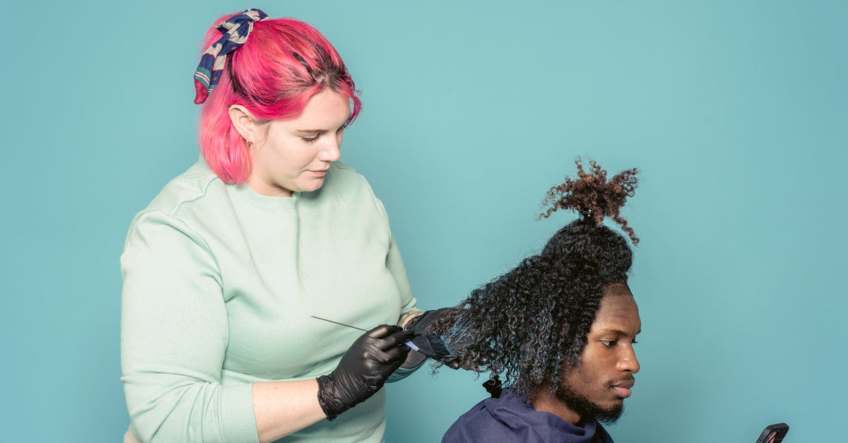 Cell phone service providers in France with English customer support - Hairdresser applying paint on hair of black client