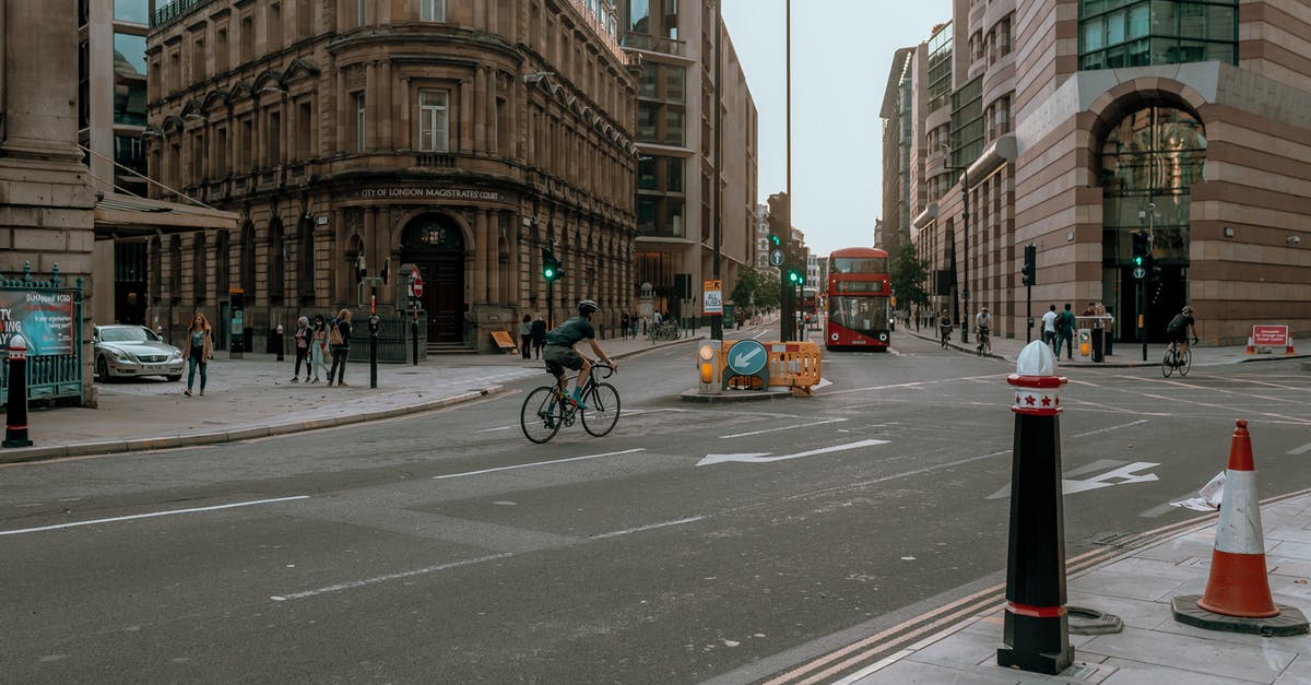 Chaining bikes in London - Man in Black Jacket Riding Bicycle on Road