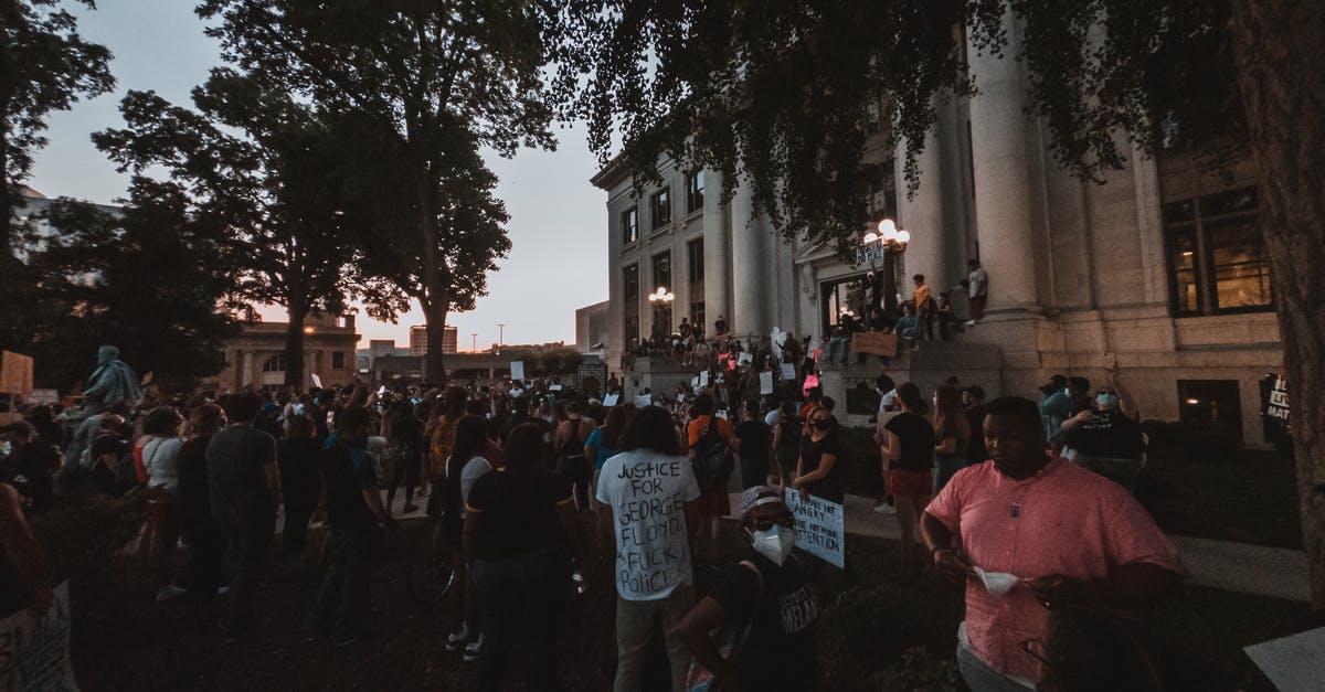 Change of transit country [closed] - Multiethnic people in demonstration for rights in city