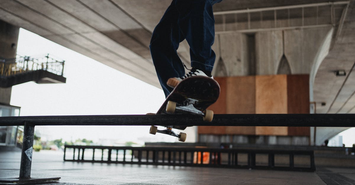 Change trains in Brest (Belarus) under 15 minutes? - Unrecognizable skater doing grind trick on rail in skater training area