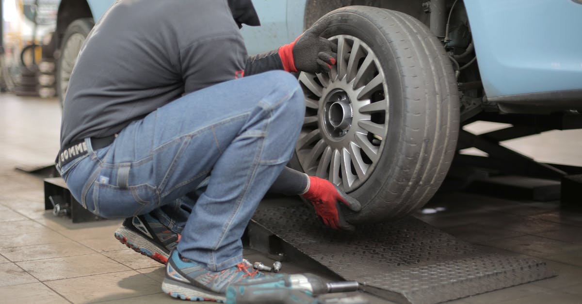 Changing a TGV booking - Man Changing a Car Tire