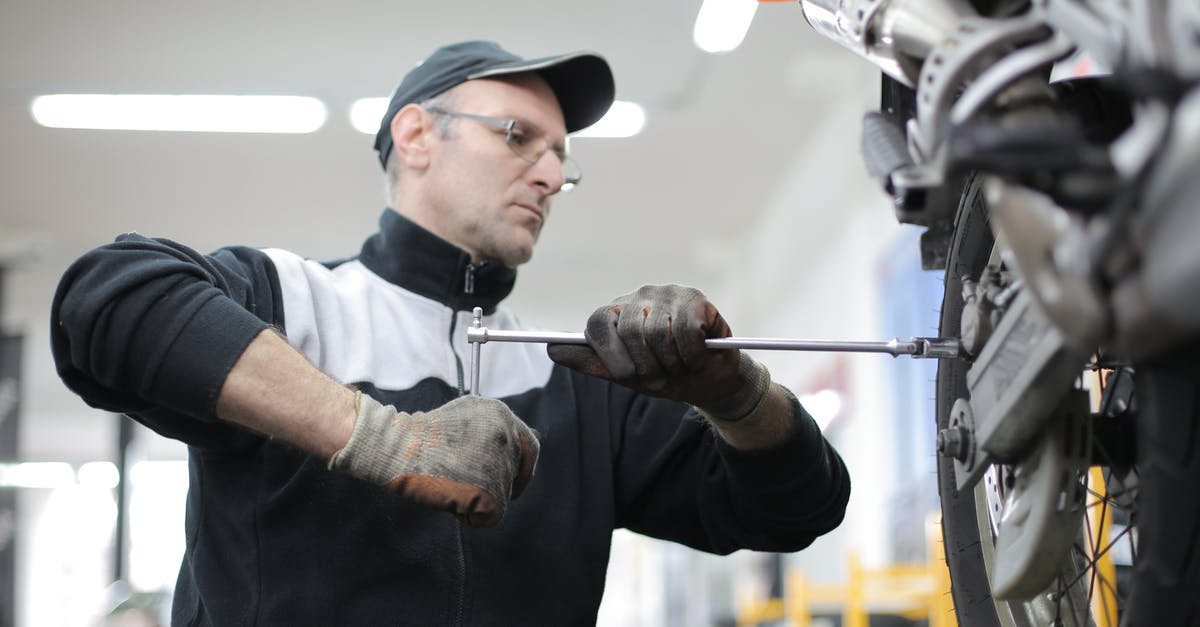 Changing a TGV booking - Photo of Man Fixing a Motorcycle