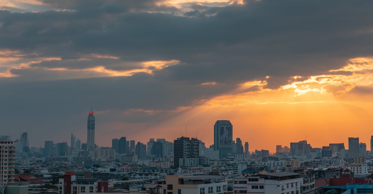 Changing airlines in Bangkok, Thailand in transit from Laos to Colombo, Sri Lanka - City Skyline Under Cloudy Sky during Sunset