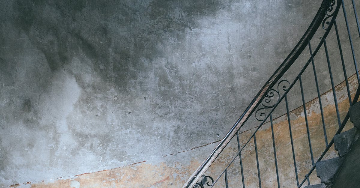 Changing from single entry to multiple entry visa - Stairway with metal railings and old shabby walls in porch of dwell building in city