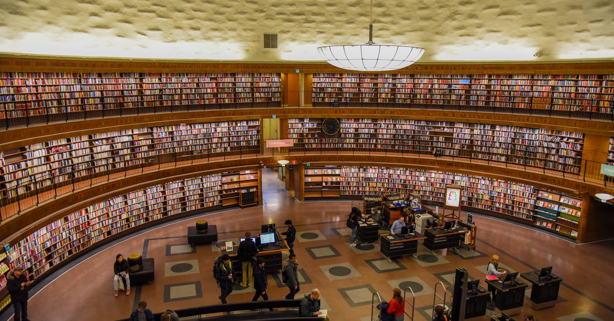 Changing status from Tier 4 to visitor - Modern public library with anonymous employees and visitors in hall