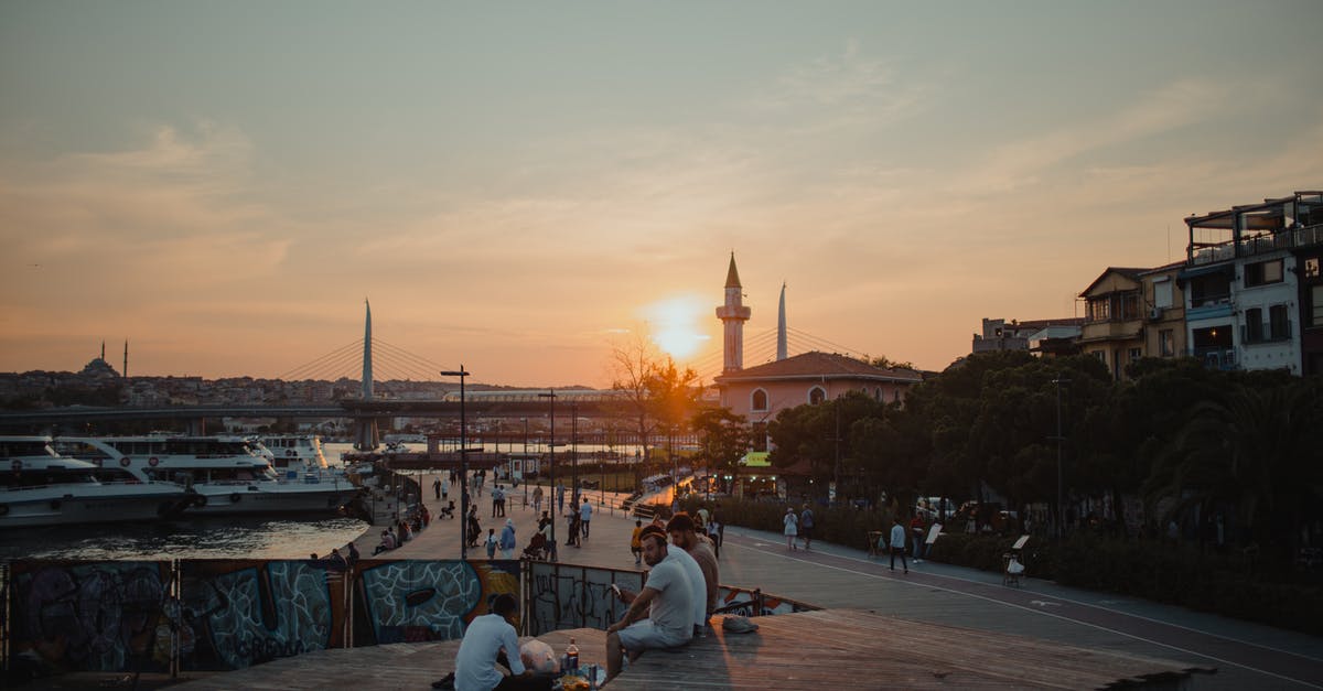 Chania port to Chania city - People Sitting on Brown Wooden Dock