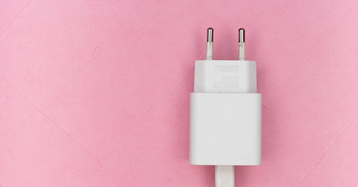 Charging mobile phones in Mongolia - Mobile  Adapter on Pink Surface