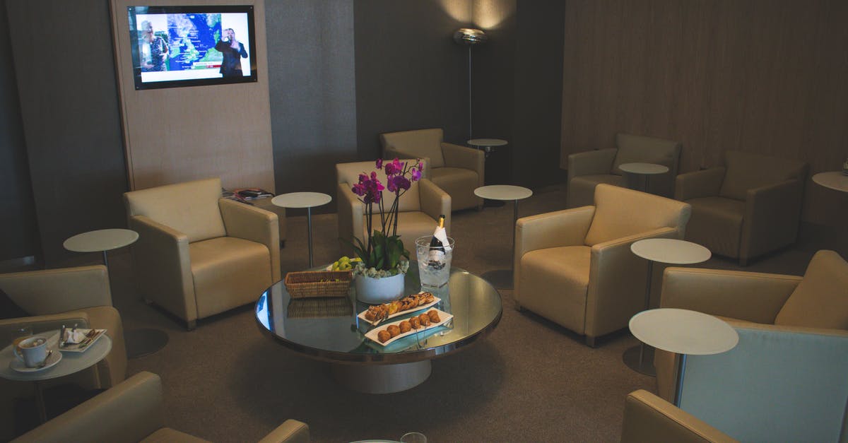 Cheap airport hotel at Sheremetyevo International Airport - White Sofa Chairs Near Tv