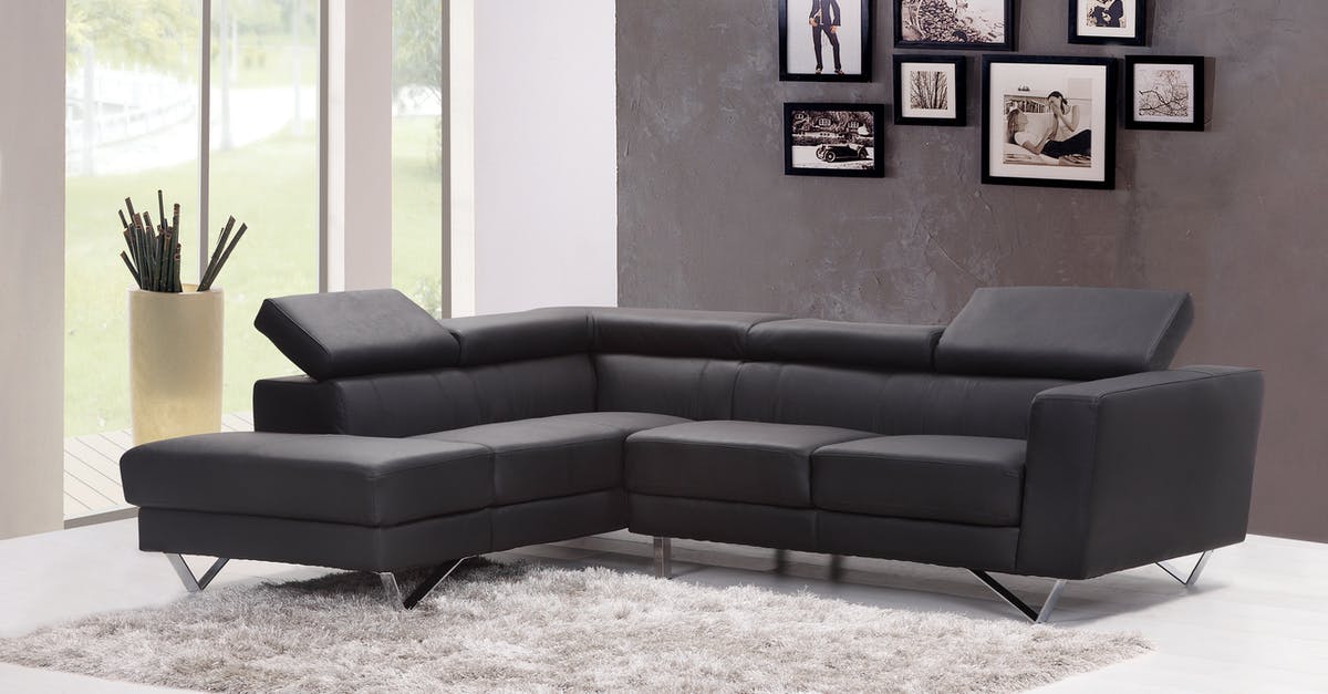 Cheap hotels with family rooms near motorways in France - Black Fabric Sectional Sofa Near Glass Window