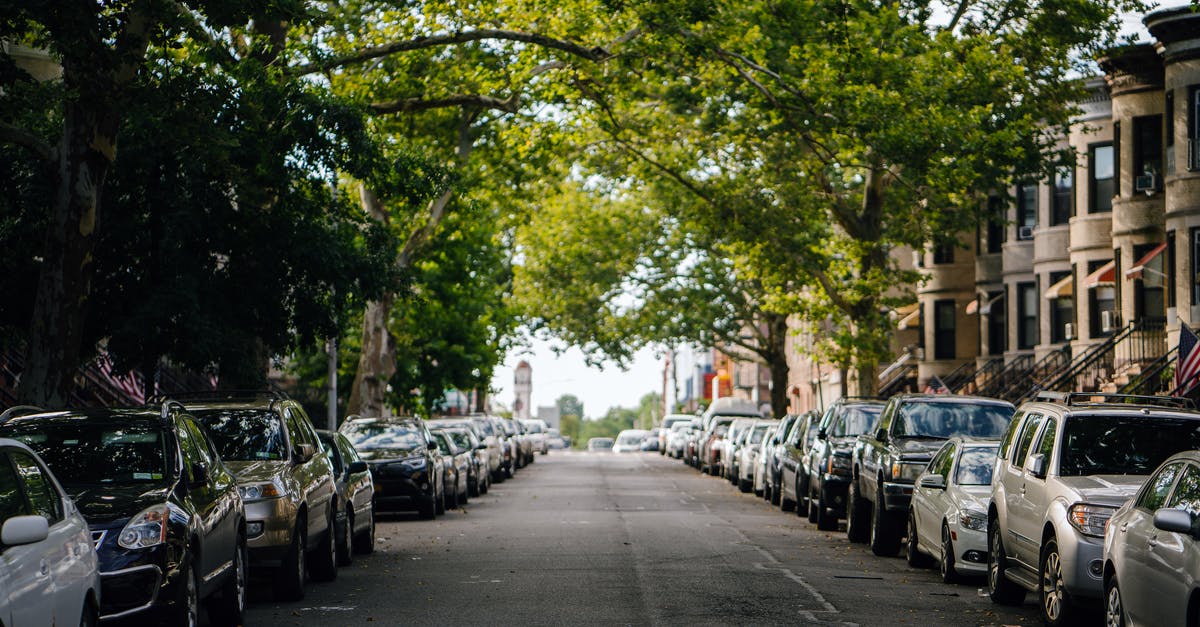 Cheap parking near YUL with free shuttle - Photo of Cars Parked Along Roadside