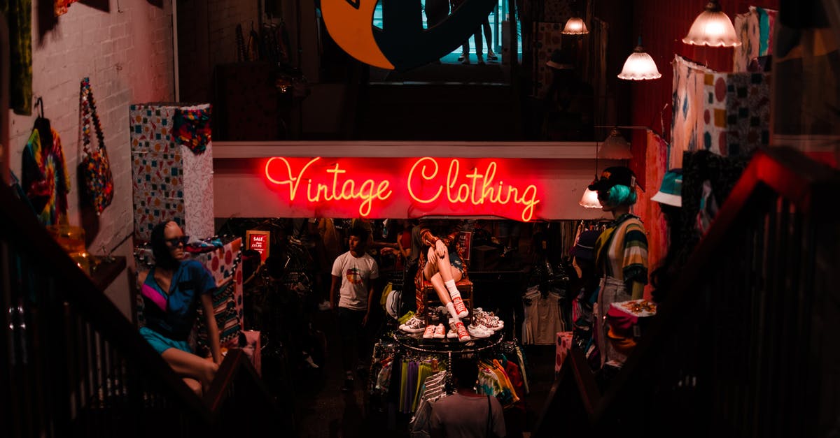 Cheap places to store bags in London for a few hours? - Neon sign in shop with vintage clothes