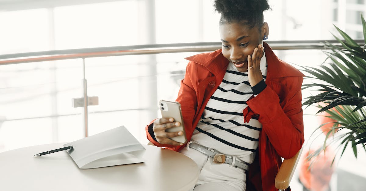 Cheapest mobile operator in Europe [duplicate] - Smiling Girl Looking at her Phone