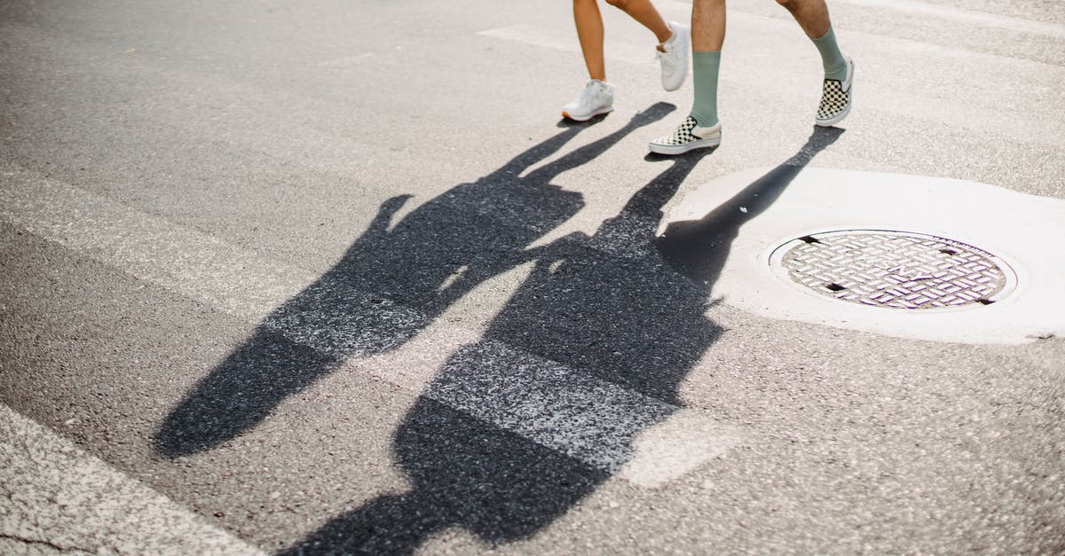 Cheapest way to get from SFO to Stanford? [closed] - Young couple crossing road on crosswalk