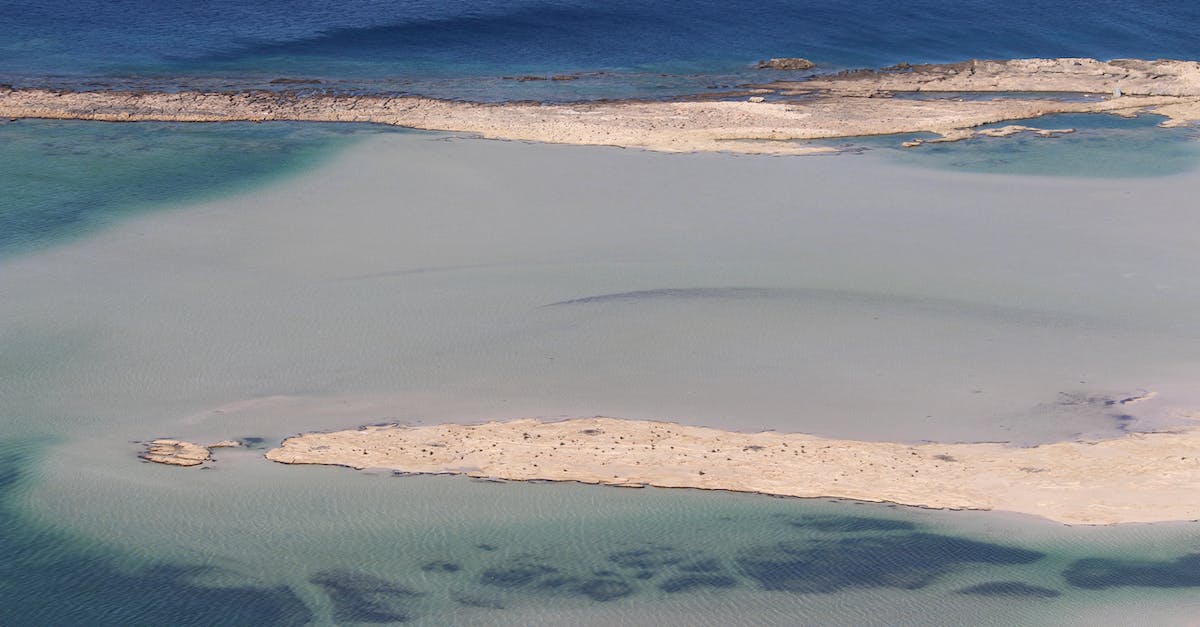 Cheapest way to get from Zurich to Elba Island, Italy? - Narrow sandy paths in sea