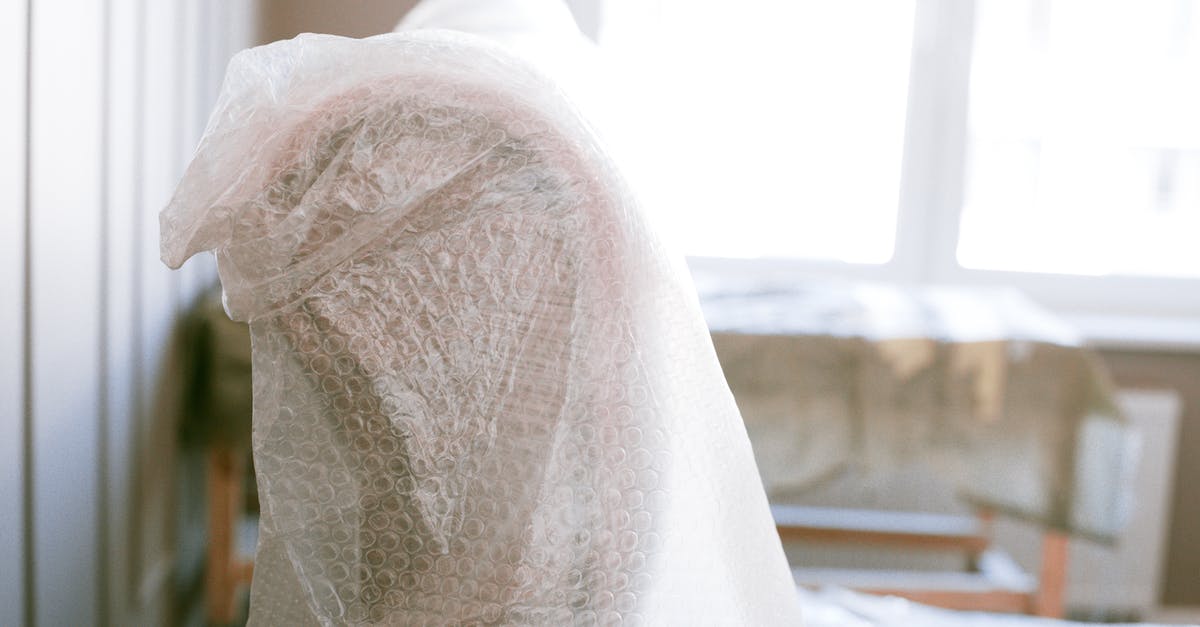 Checked baggage bubble wrapped only - Shallow Focus Photo of Furniture With Bubble Wrap