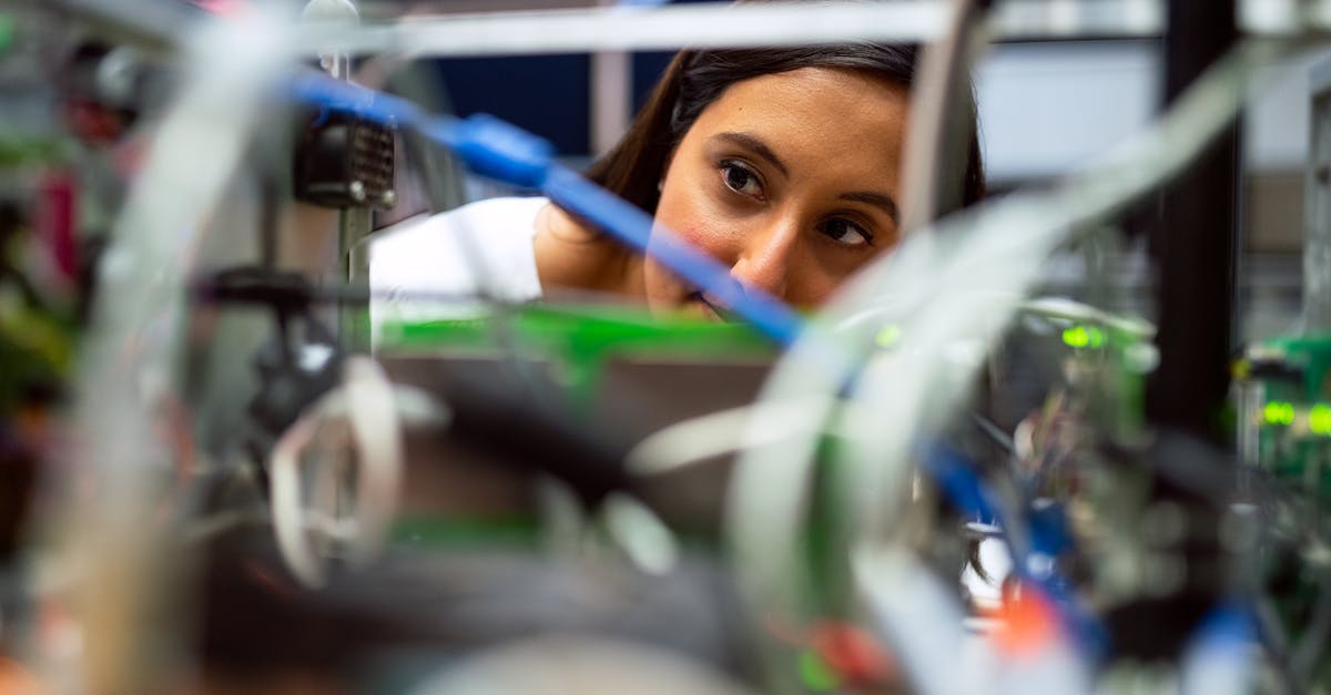 Checking ski equipment on plane - Photo Of Female Engineer Looking Through Wires