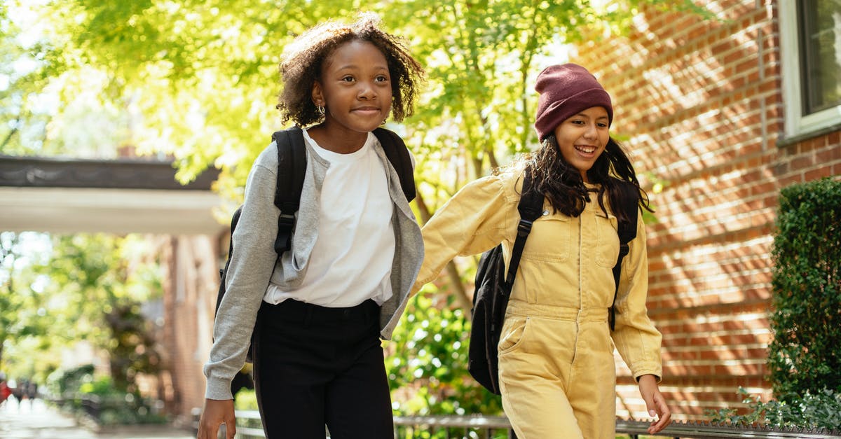 Child Accompanied Visa - can you return with another adult? - Cheerful friends walking together in sunny day