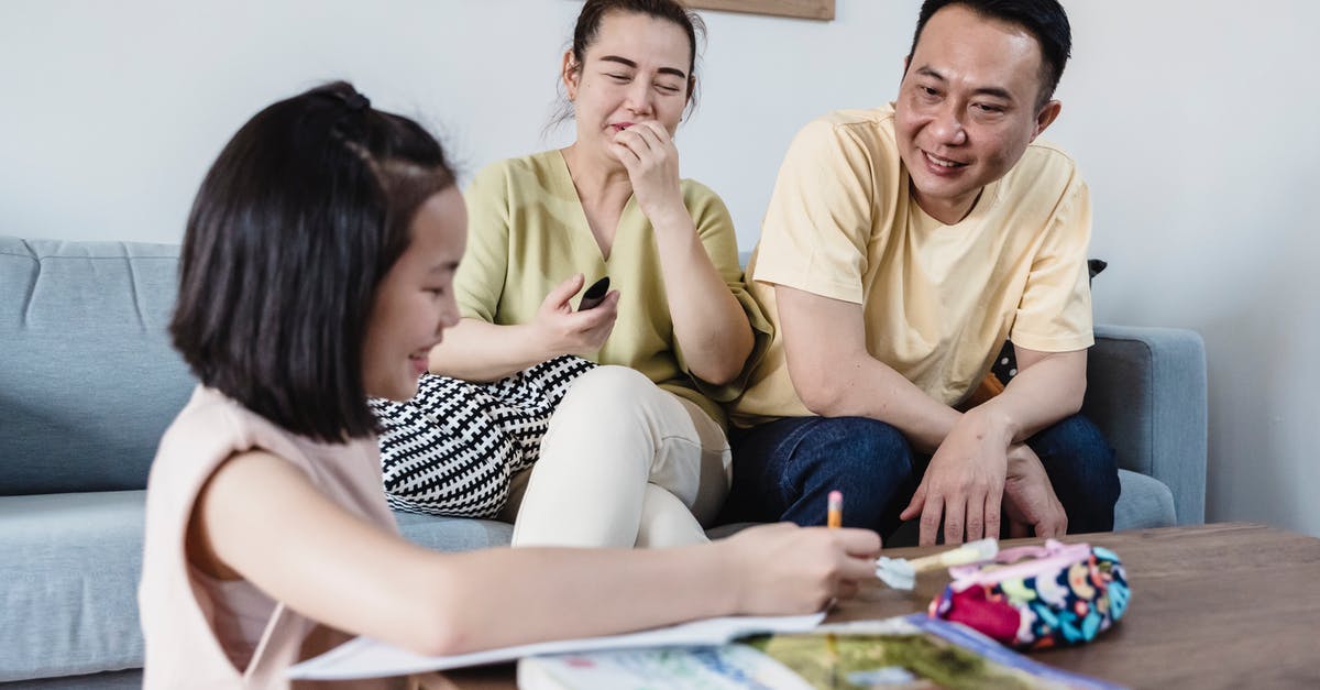 Child entering Canada with both parents - A Girl Showing her Homework to her Parents