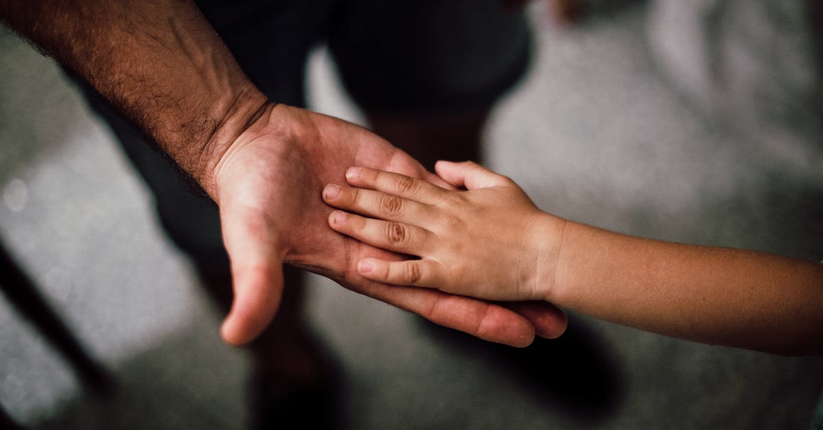 Child passport validity - Selective Focus Photography of Child's Hand