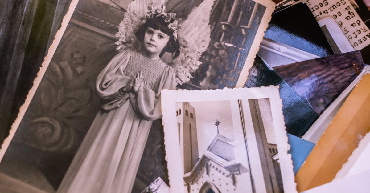 Children’s photos exchanged [closed] - Close-up Of Old Black and White Photos Of A Young Girl In An Angel Costume And A Church