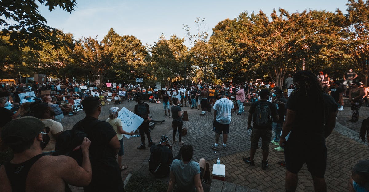 Chilean, Canadian national transit through the US during COVID-19 [duplicate] - Diverse people uniting on demonstration against politics