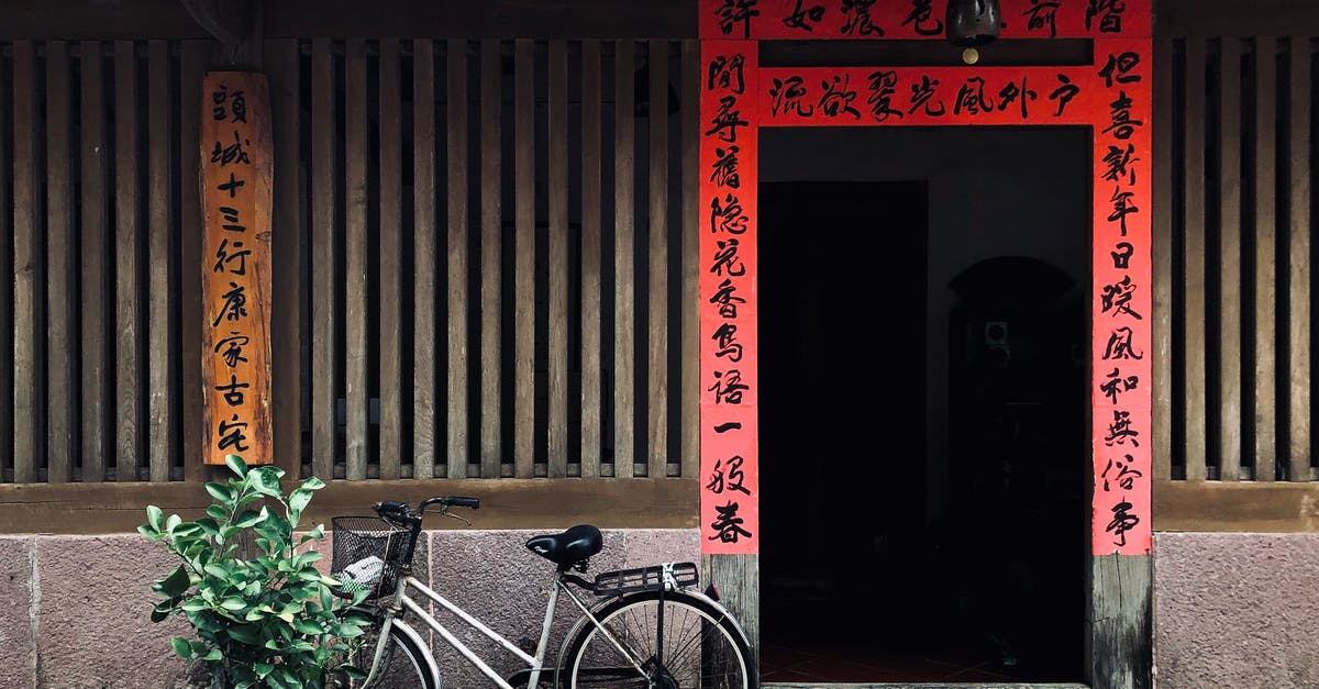 Chinese L visa expiration? - Black City Bike Parked Beside Red Wooden Door