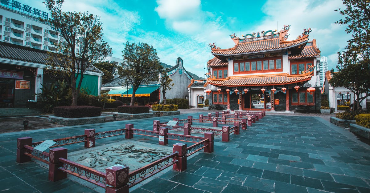 Chinese L visa expiration? - Red and White Concrete Building Under Blue Sky