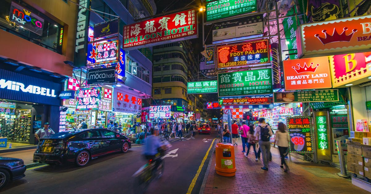 Chinese tourist L visa and visiting Hong Kong - Man Riding Bike on Street during Nighttime