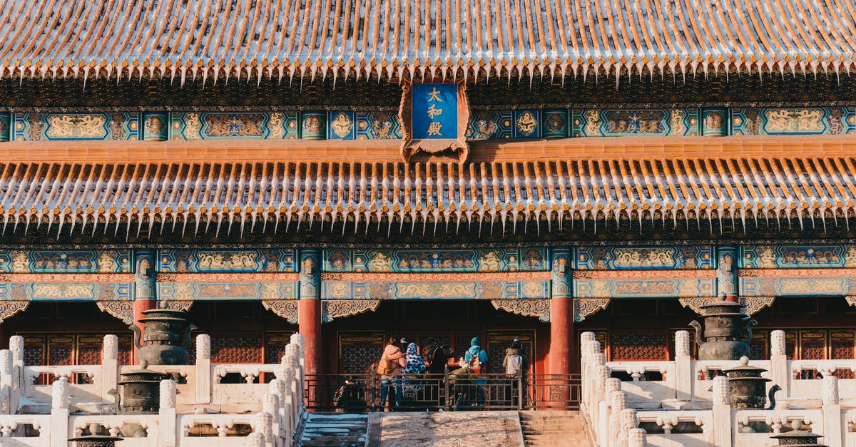 Chinese visiting England, have Schengen visa - Group of People Visiting Chinese Ancient Building in Winter