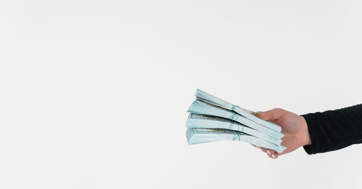 Citibank Cash withdrawal in Barcelona - A Person Holding Bundles of Cash Money