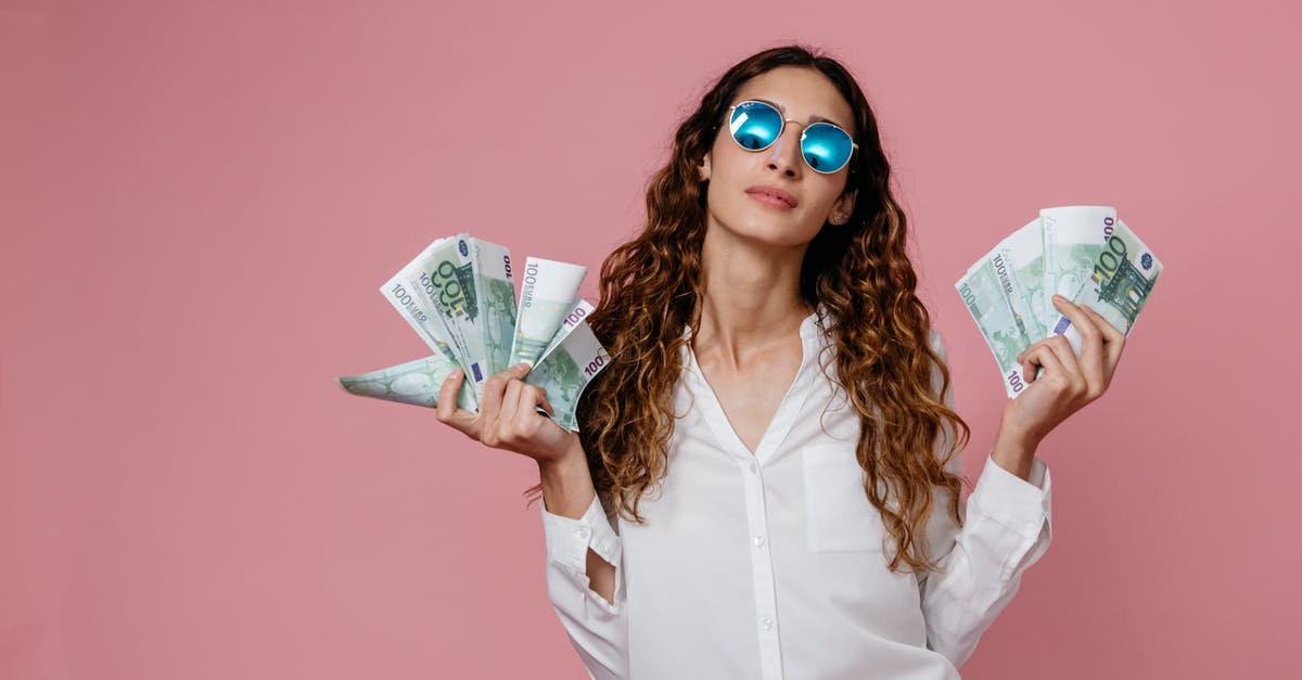 Citibank Cash withdrawal in Barcelona - A Woman in White Long Sleeve Button Up Shirt Holding Bank Notes