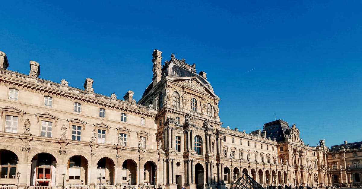 Citizens Advice Bureau France - People Walking Near Brown Concrete Building