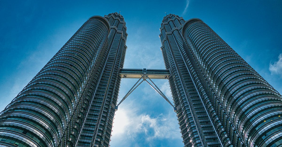 City in Peninsular Malaysia to immerse in Malay language? - Low Angle Photography of High Rise Building Under Blue Sky